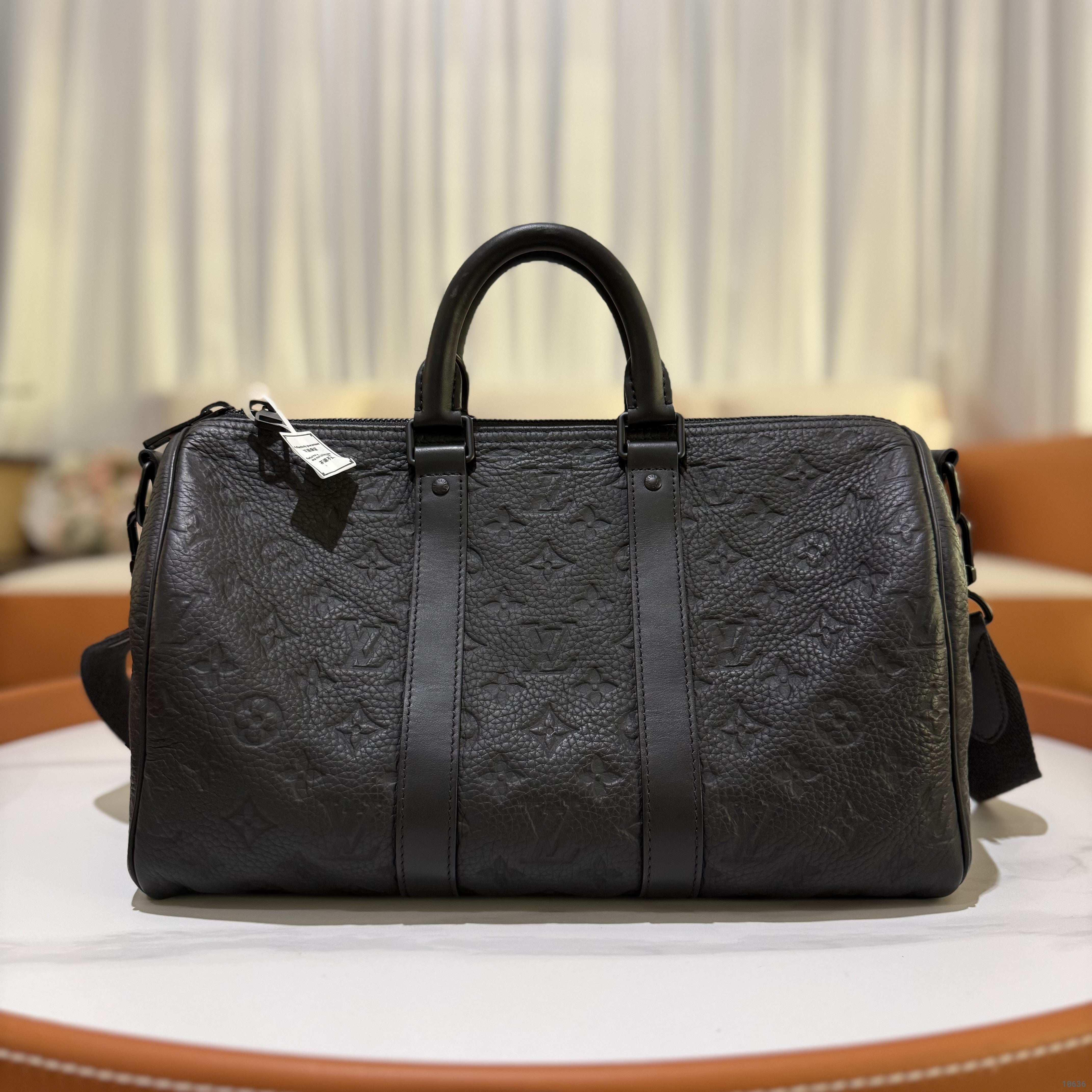 LOUIS VUITTON KEEPALL 35 EMBOSSED SHOULDER & CROSSBODY BAG