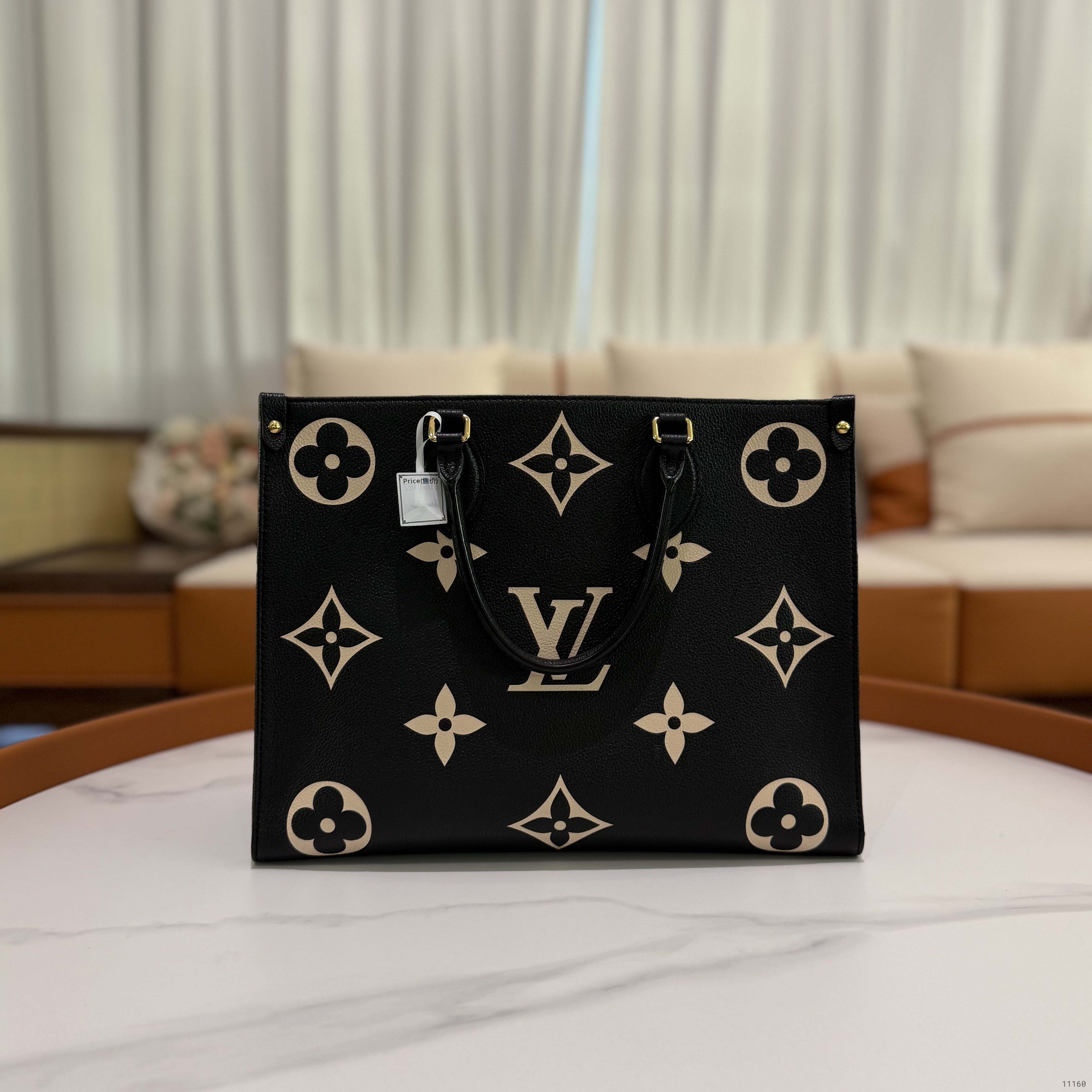 LOUIS VUITTON ON THE GO TOTE MEDIUM BLACK AND WHITE EMBOSSED LEATHER BAG