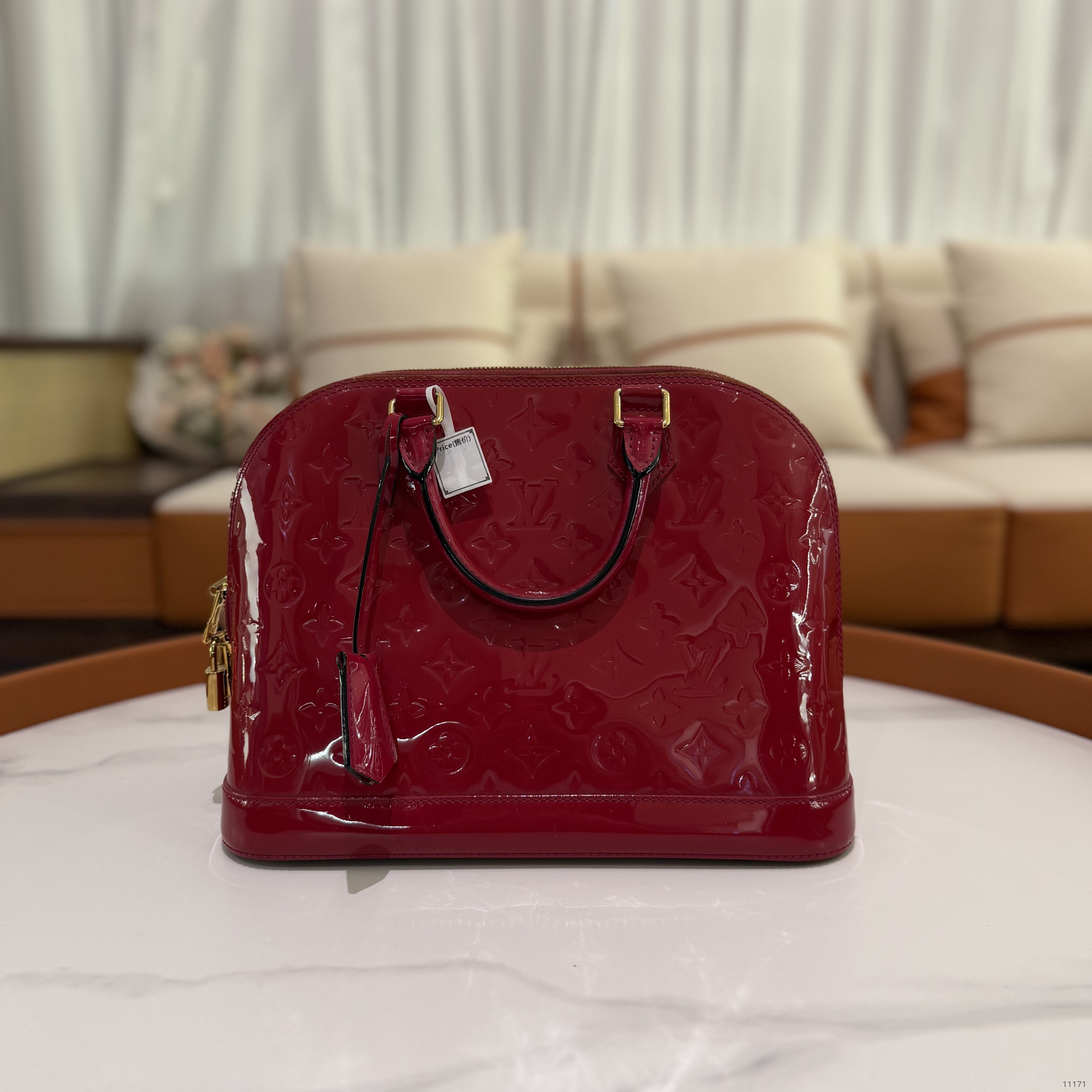 LOUIS VUITTON ALMA MEDIUM RED VERNIS LEATHER HANDBAG