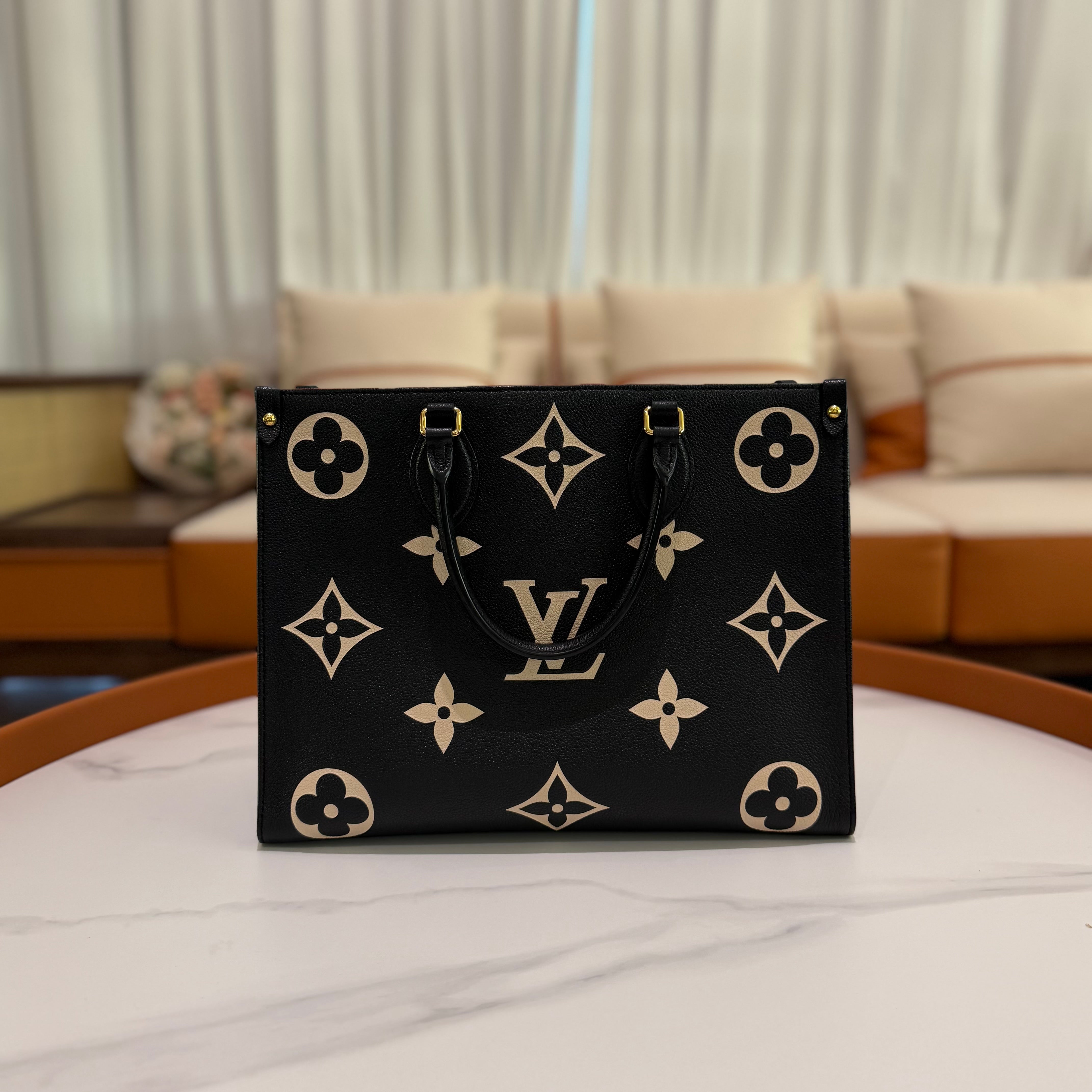 LOUIS VUITTON ON THE GO TOTE MEDIUM BLACK AND WHITE EMBOSSED LEATHER BAG