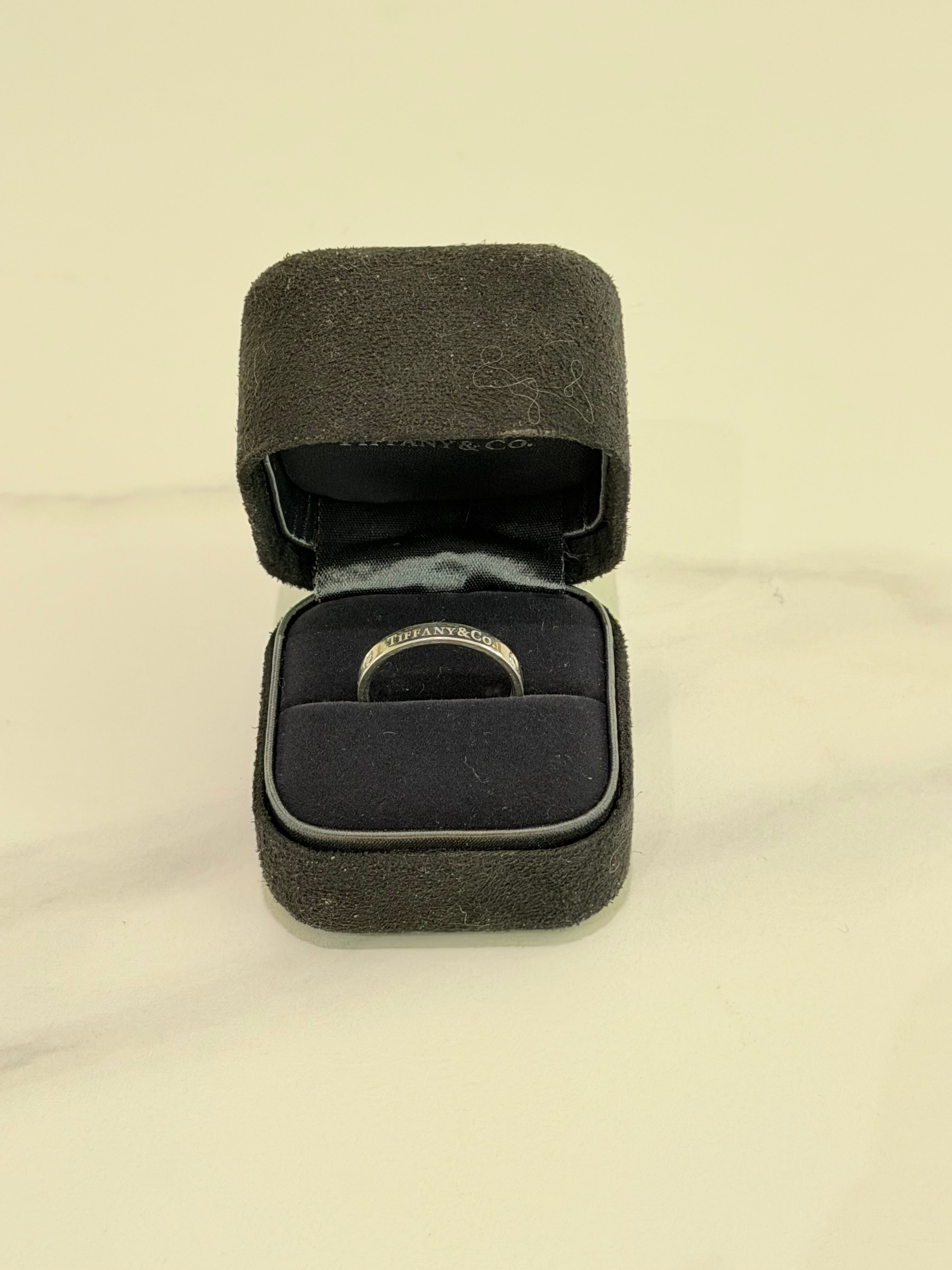 Tiffany PT950 Platinum Three-Diamond Ring (Narrow Band)