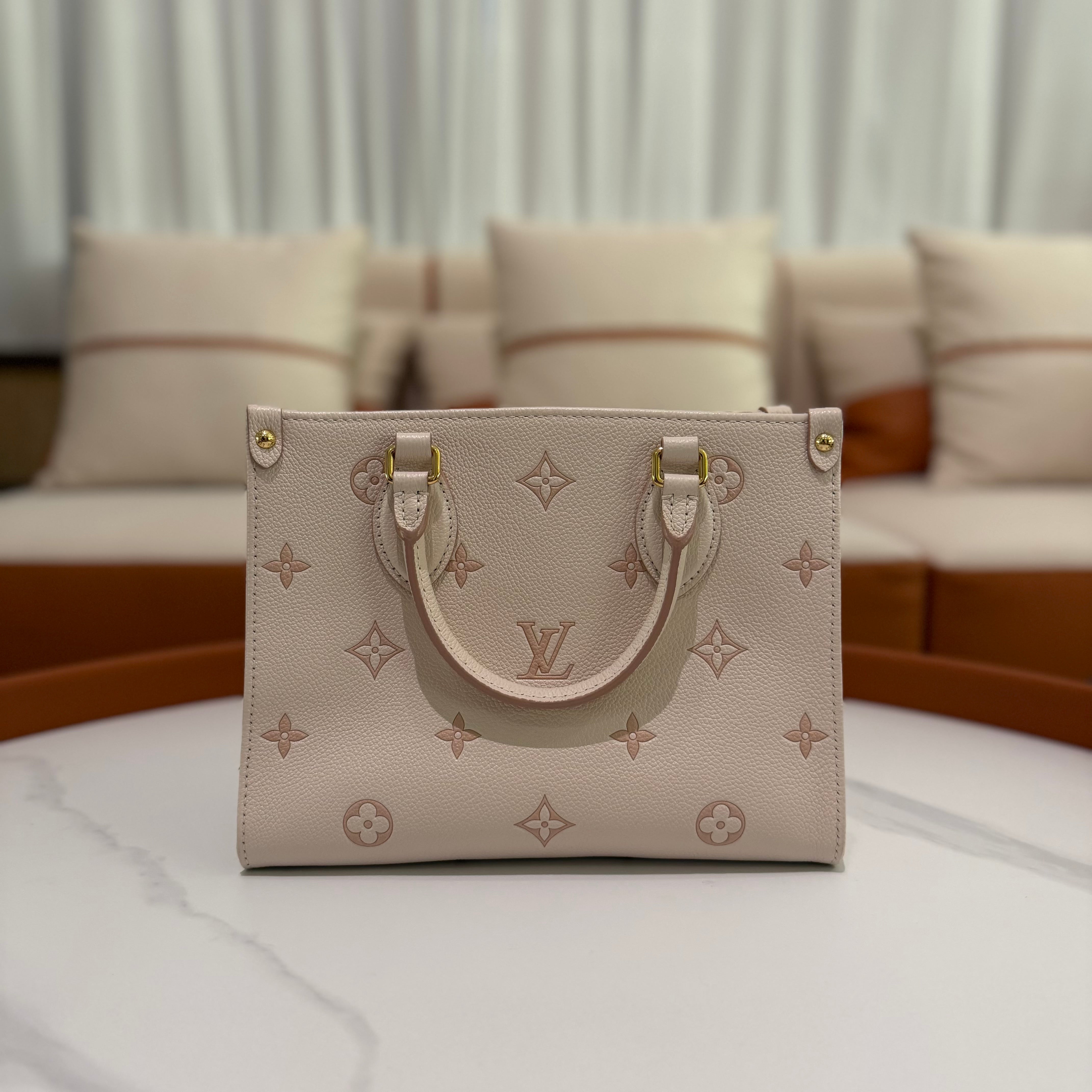 Louis Vuitton Onthego PM Almond Pink Monogram Empreinte Leather (Chip Model)