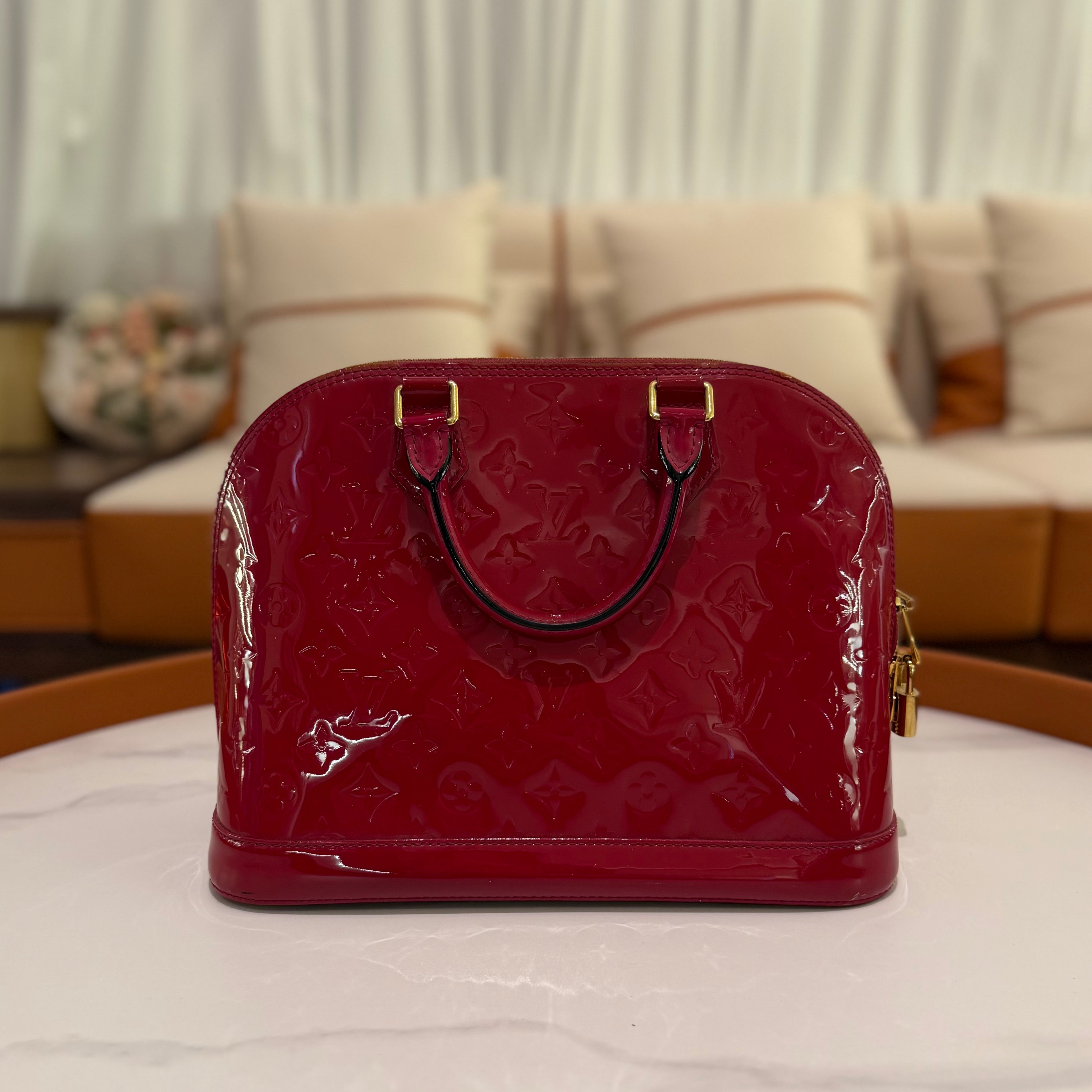 LOUIS VUITTON ALMA MEDIUM RED VERNIS LEATHER HANDBAG