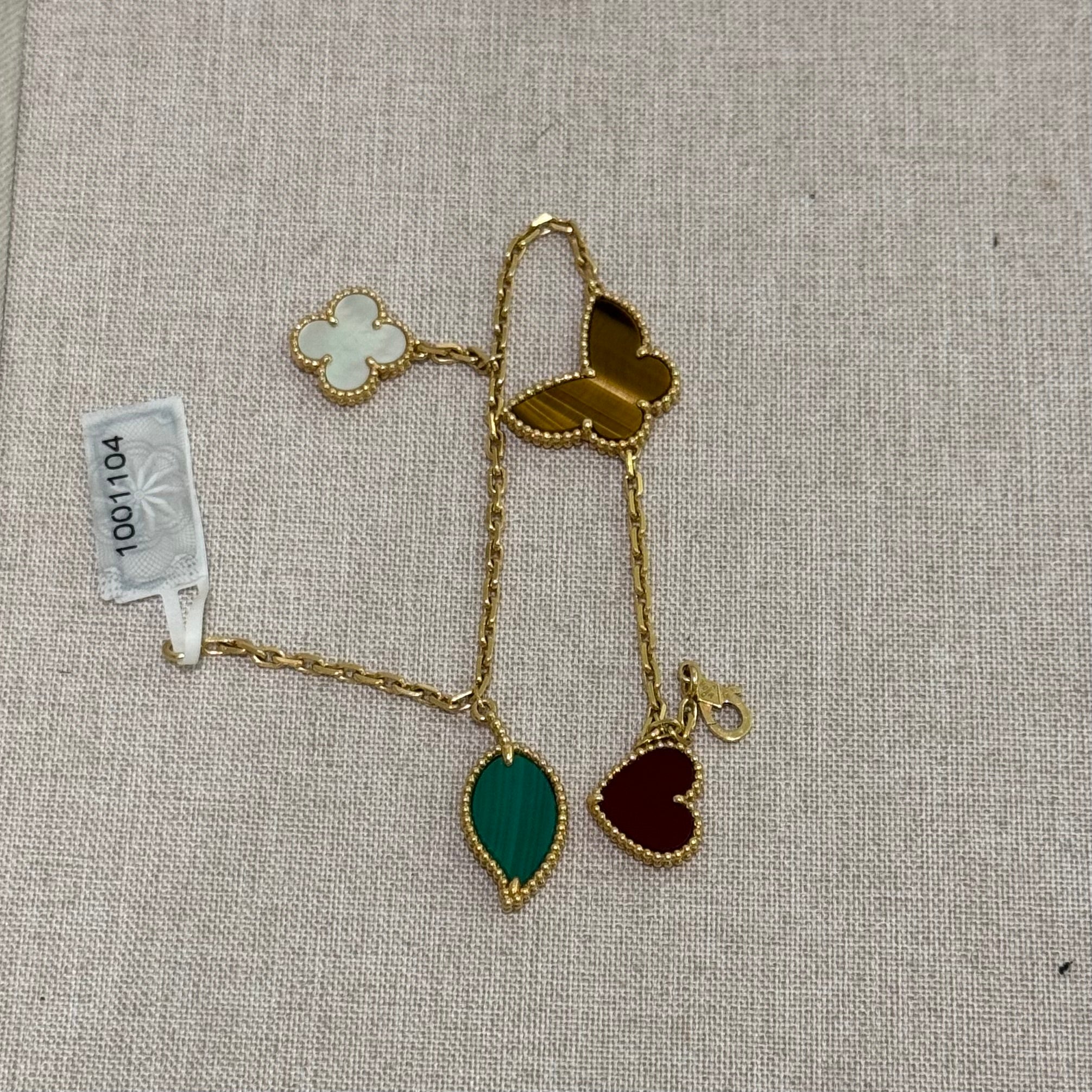 VAN CLEEF & ARPELS LUCKY ALHAMBRA BRACELET 18K YELLOW GOLD WITH MOTHER-OF-PEARL, MALACHITE, CARNELIAN & TIGER’S EYE