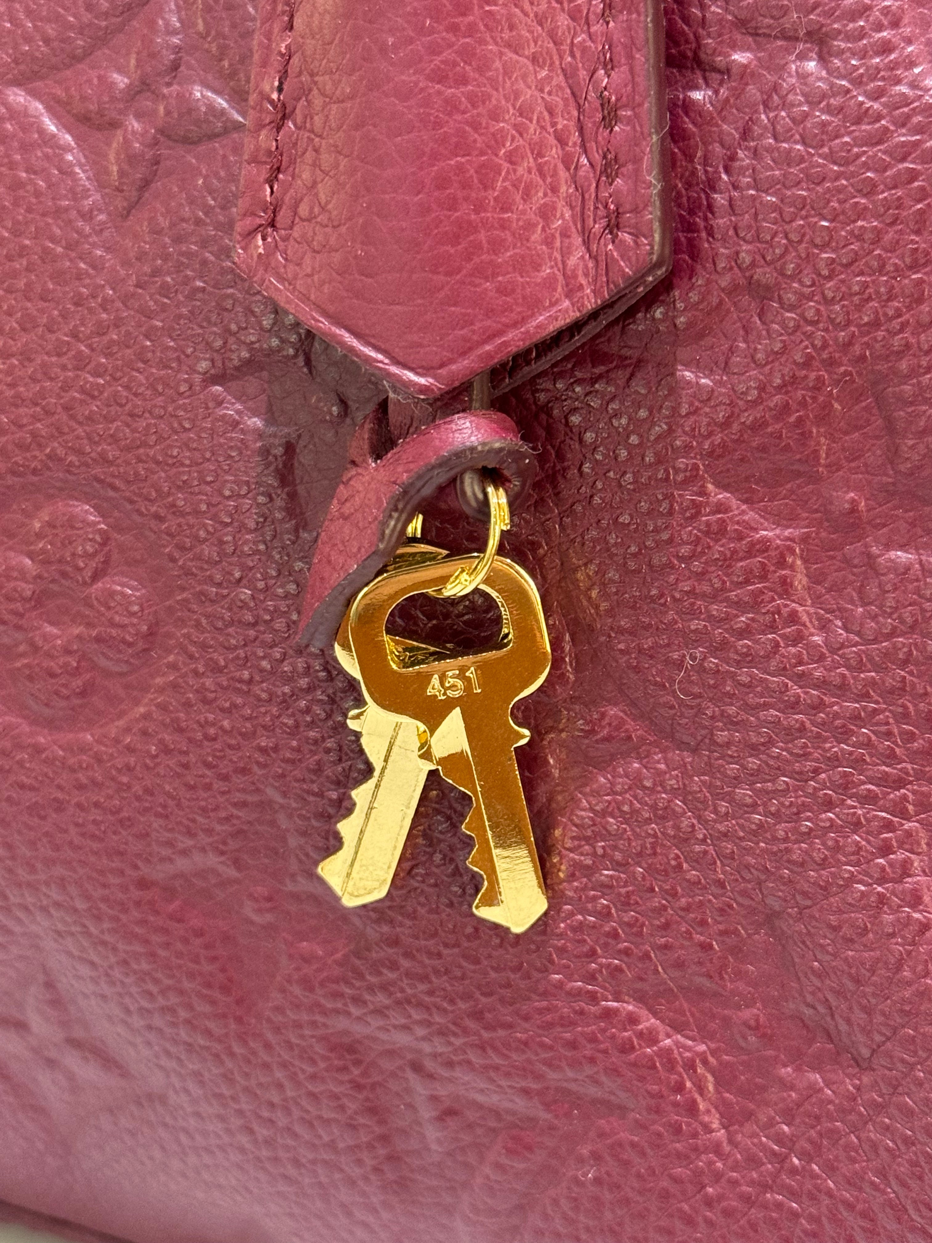 LOUIS VUITTON RED HANDBAG | COLLINS RAIN