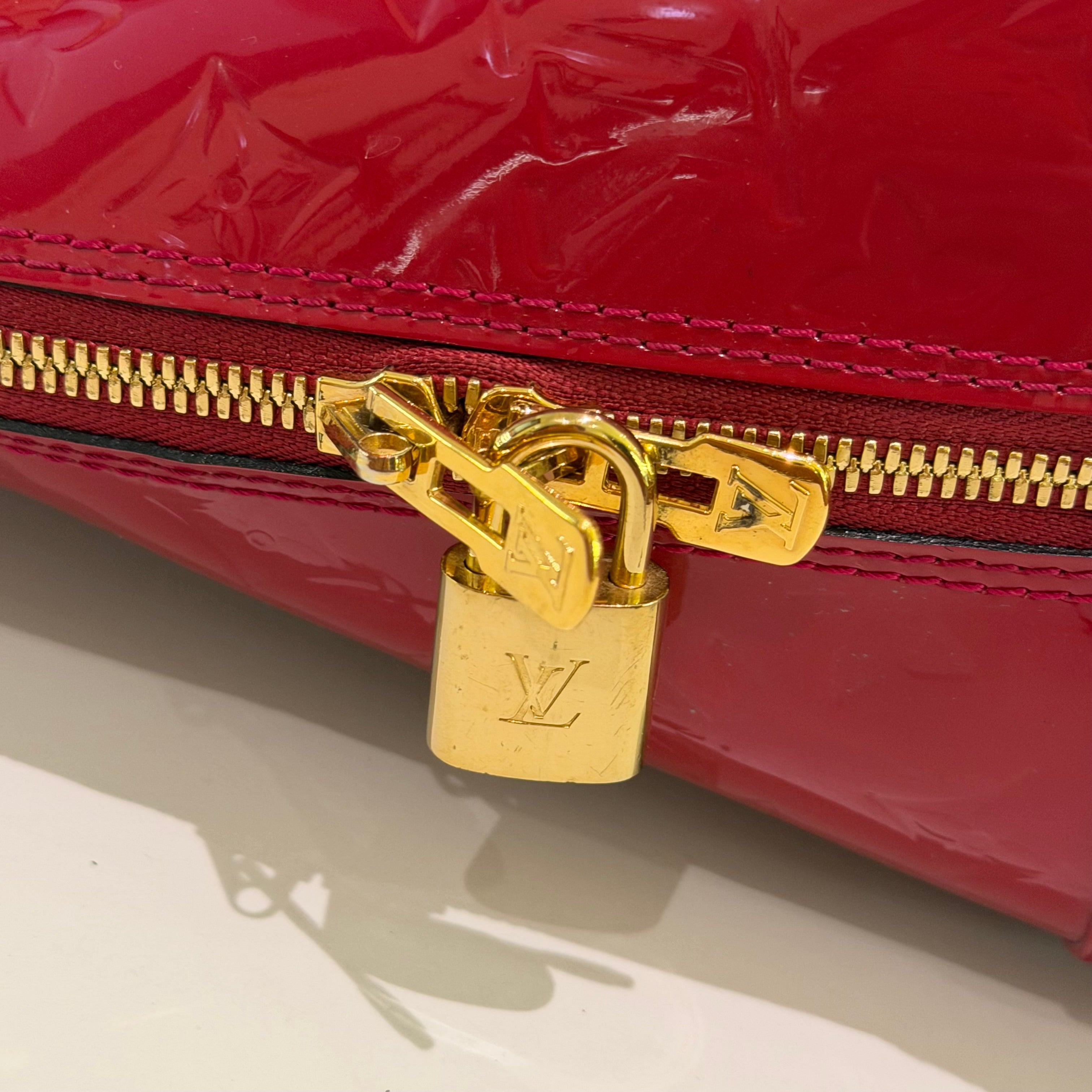 LOUIS VUITTON ALMA MEDIUM RED VERNIS LEATHER HANDBAG