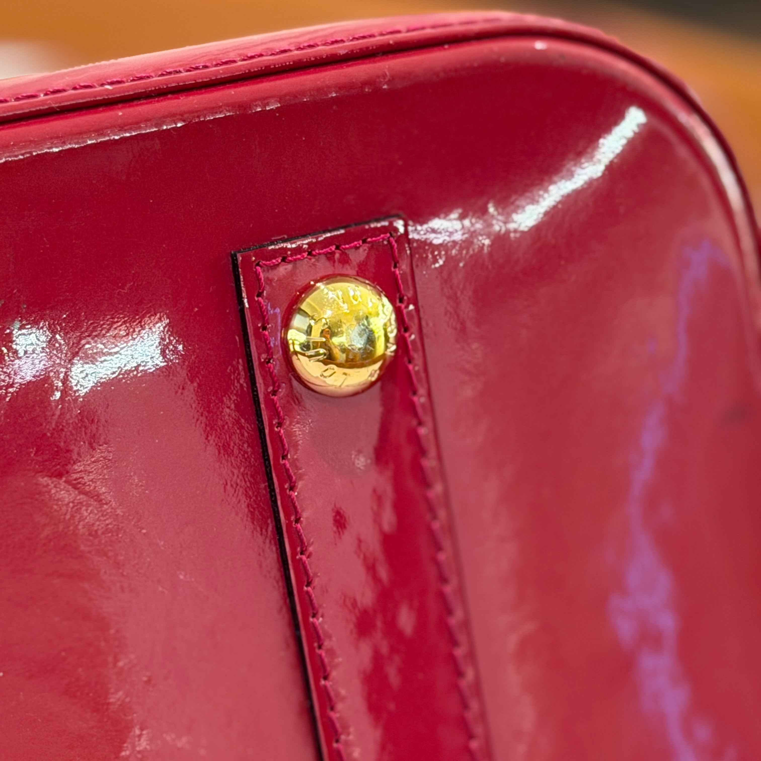 LOUIS VUITTON ALMA MEDIUM RED VERNIS LEATHER HANDBAG