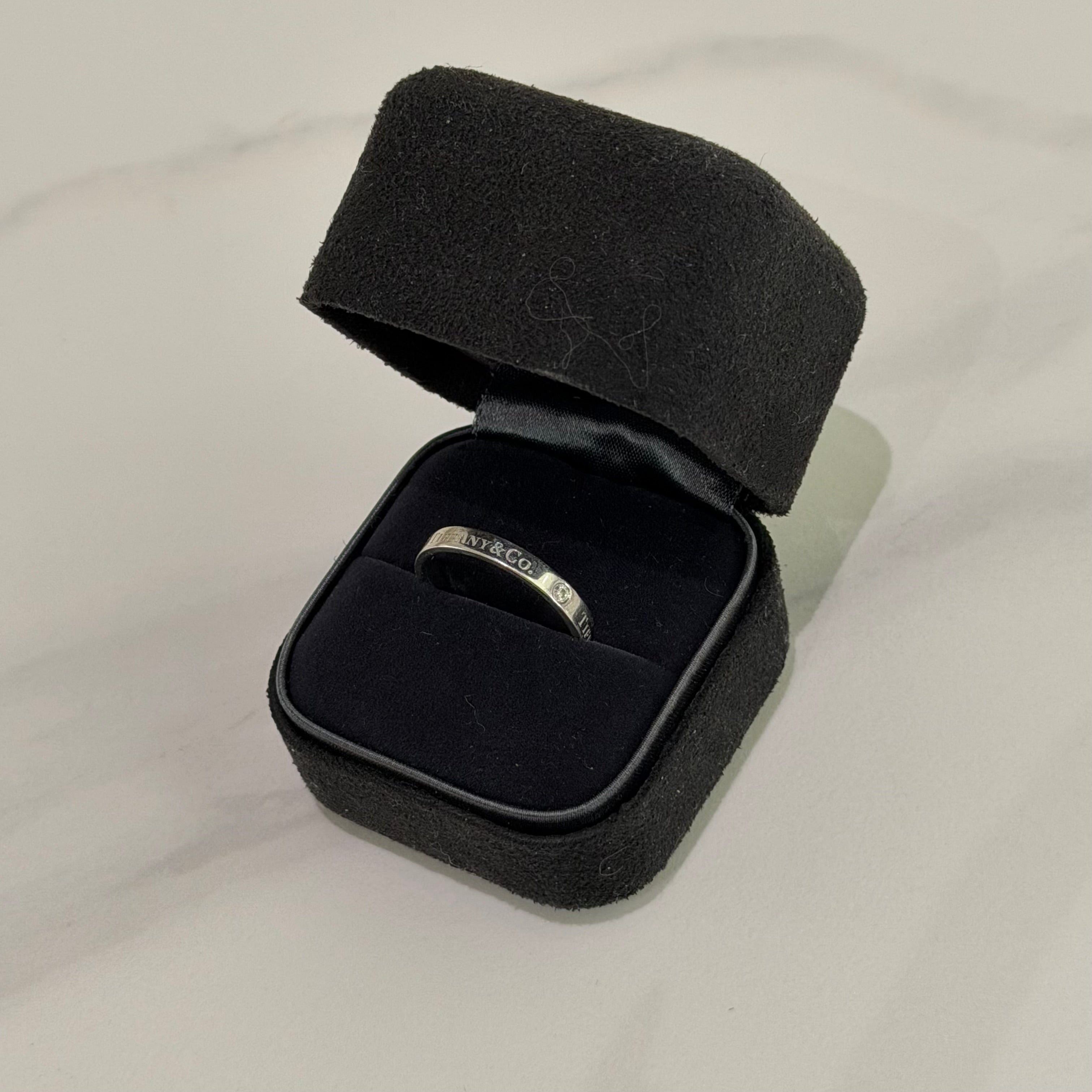 Tiffany PT950 Platinum Three-Diamond Ring (Narrow Band)