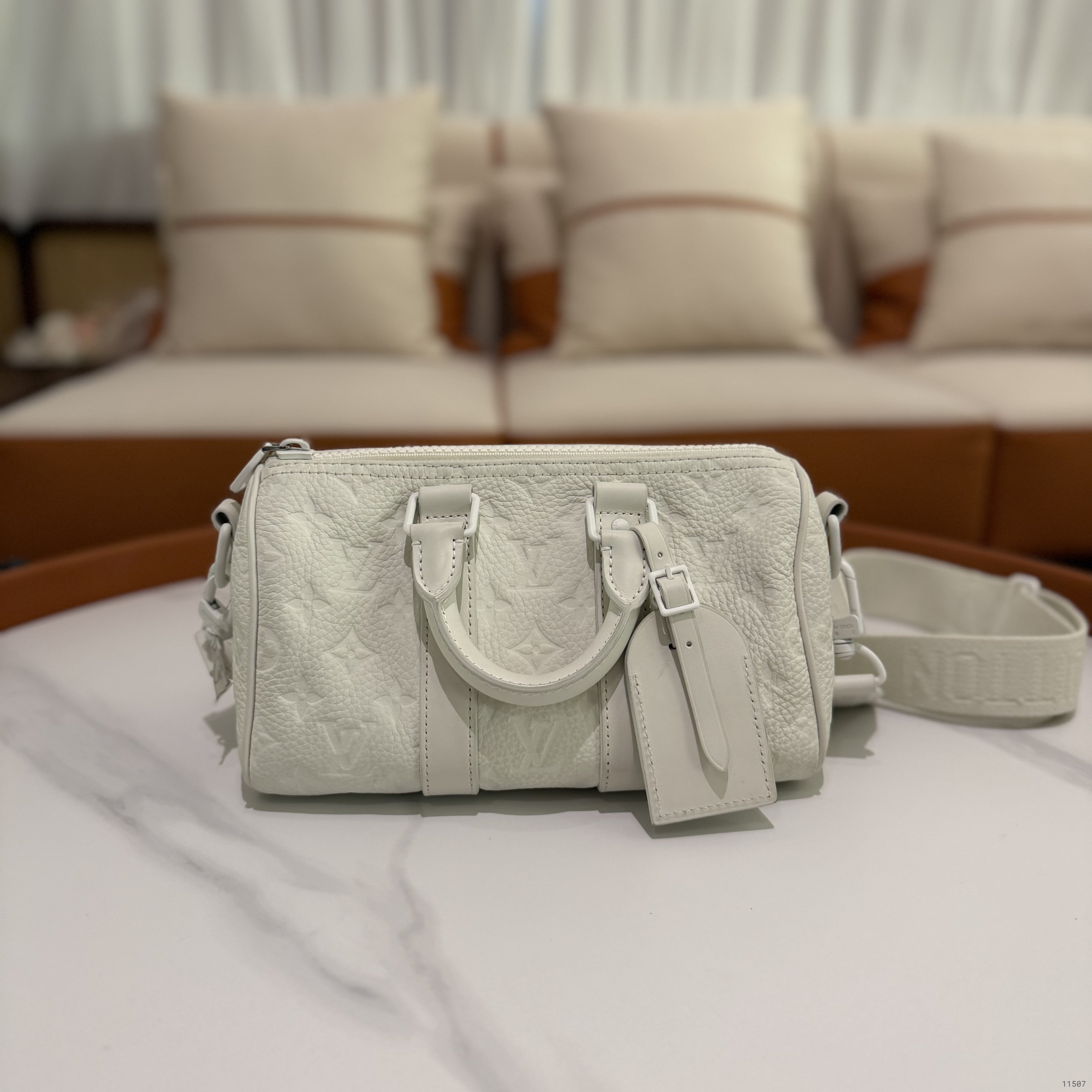 Louis Vuitton Keepall 25 White Embossed Monogram Top Handle Shoulder Bag