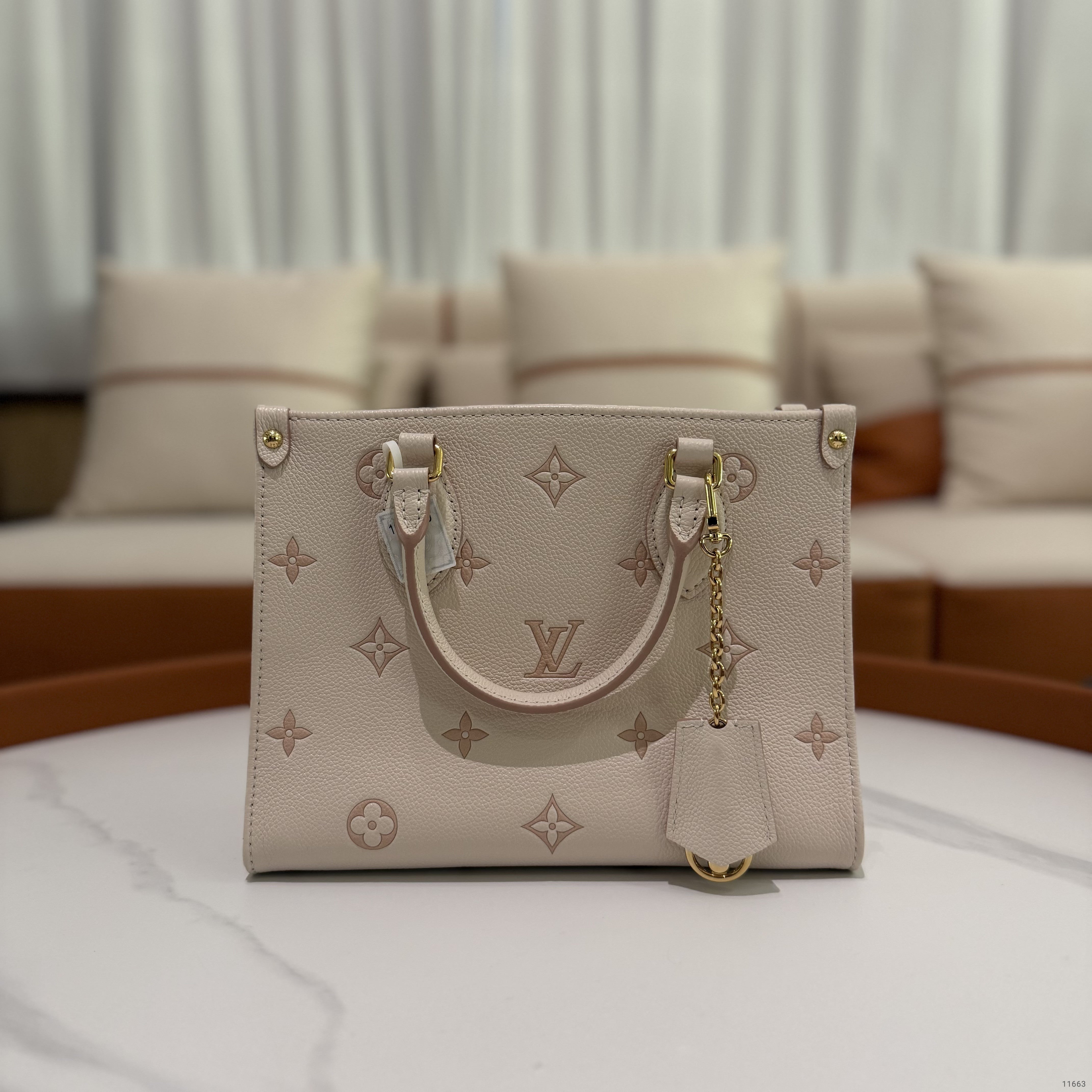 Louis Vuitton Onthego PM Almond Pink Monogram Empreinte Leather (Chip Model)