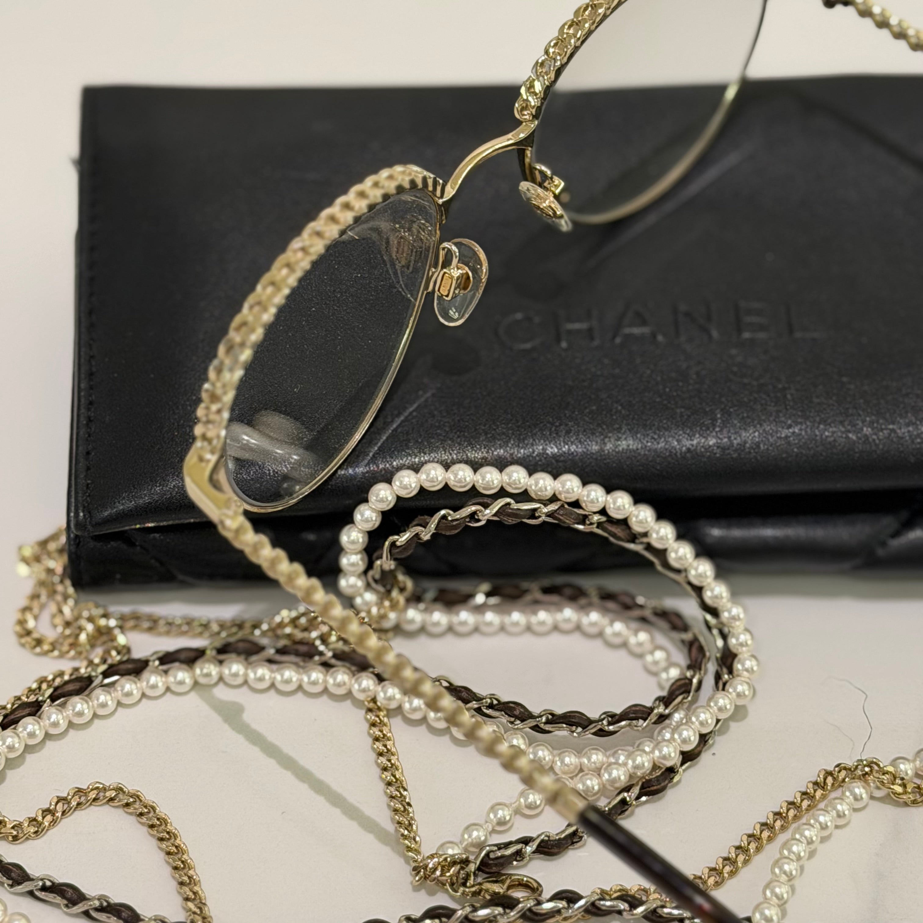 CHANEL BLACK FLAT GLASSES WITH GOLD PEARL CHAIN