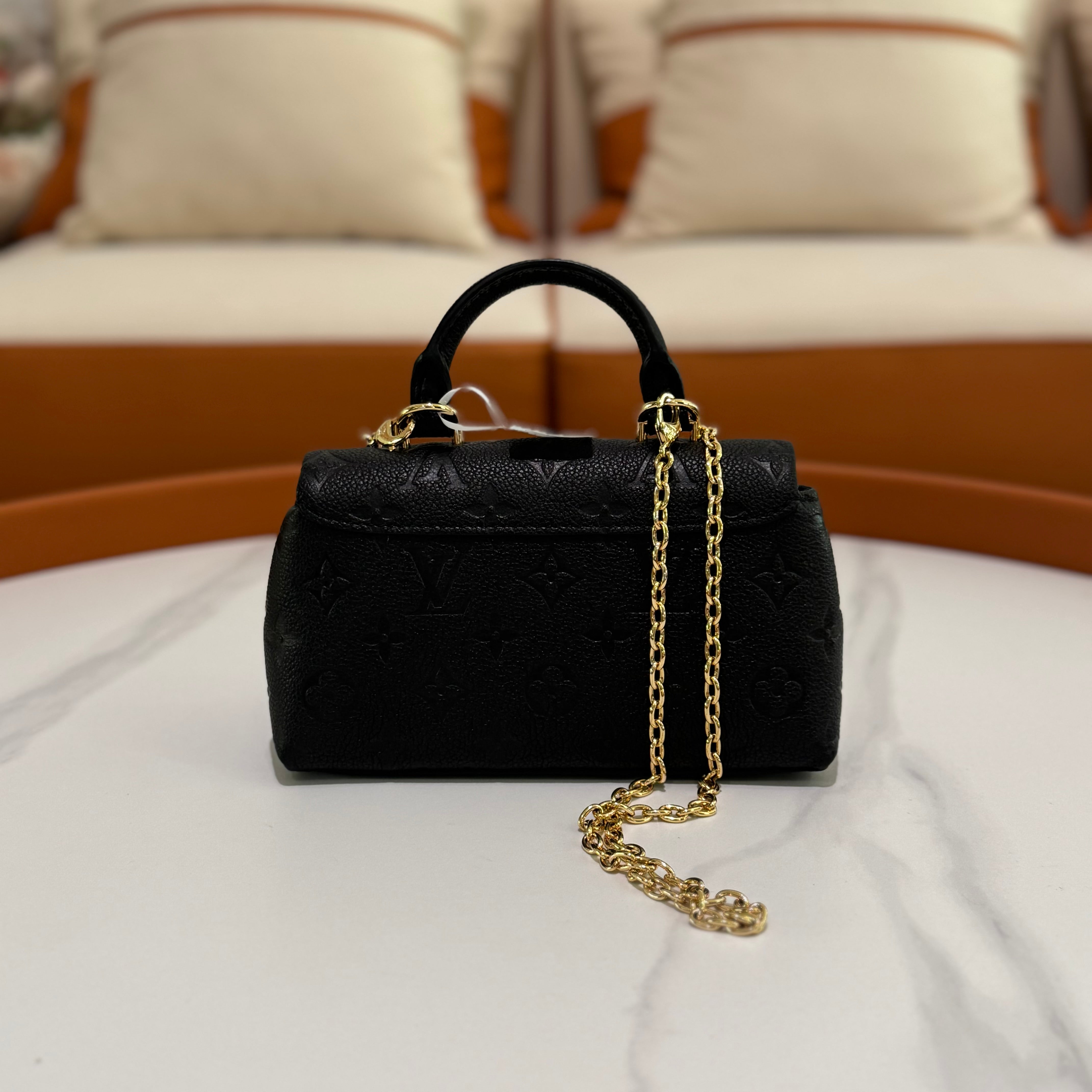 LOUIS VUITTON NANO MADELEINE EMBOSSED LEATHER TOP HANDLE CROSSBODY BAG