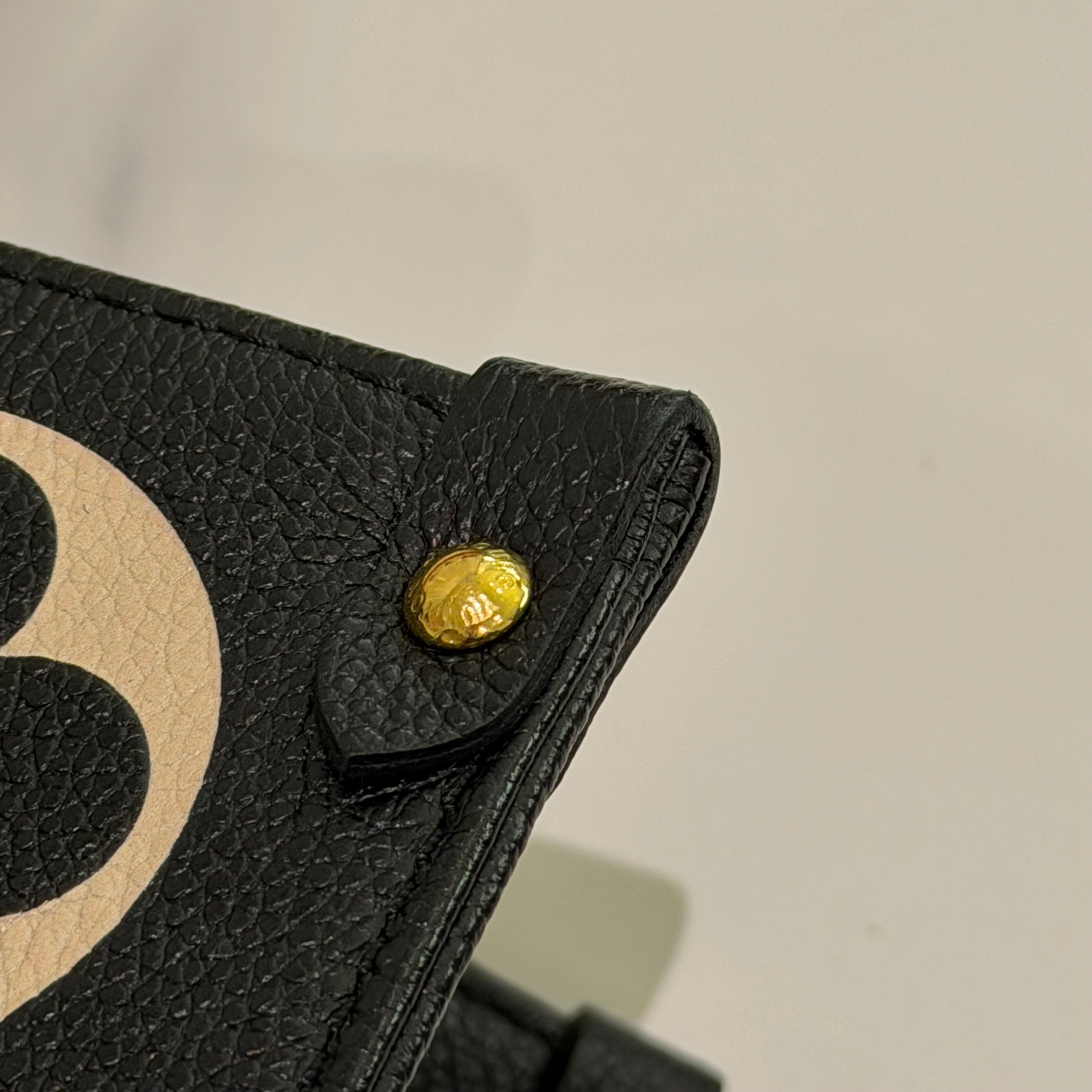 LOUIS VUITTON ON THE GO TOTE MEDIUM BLACK AND WHITE EMBOSSED LEATHER BAG