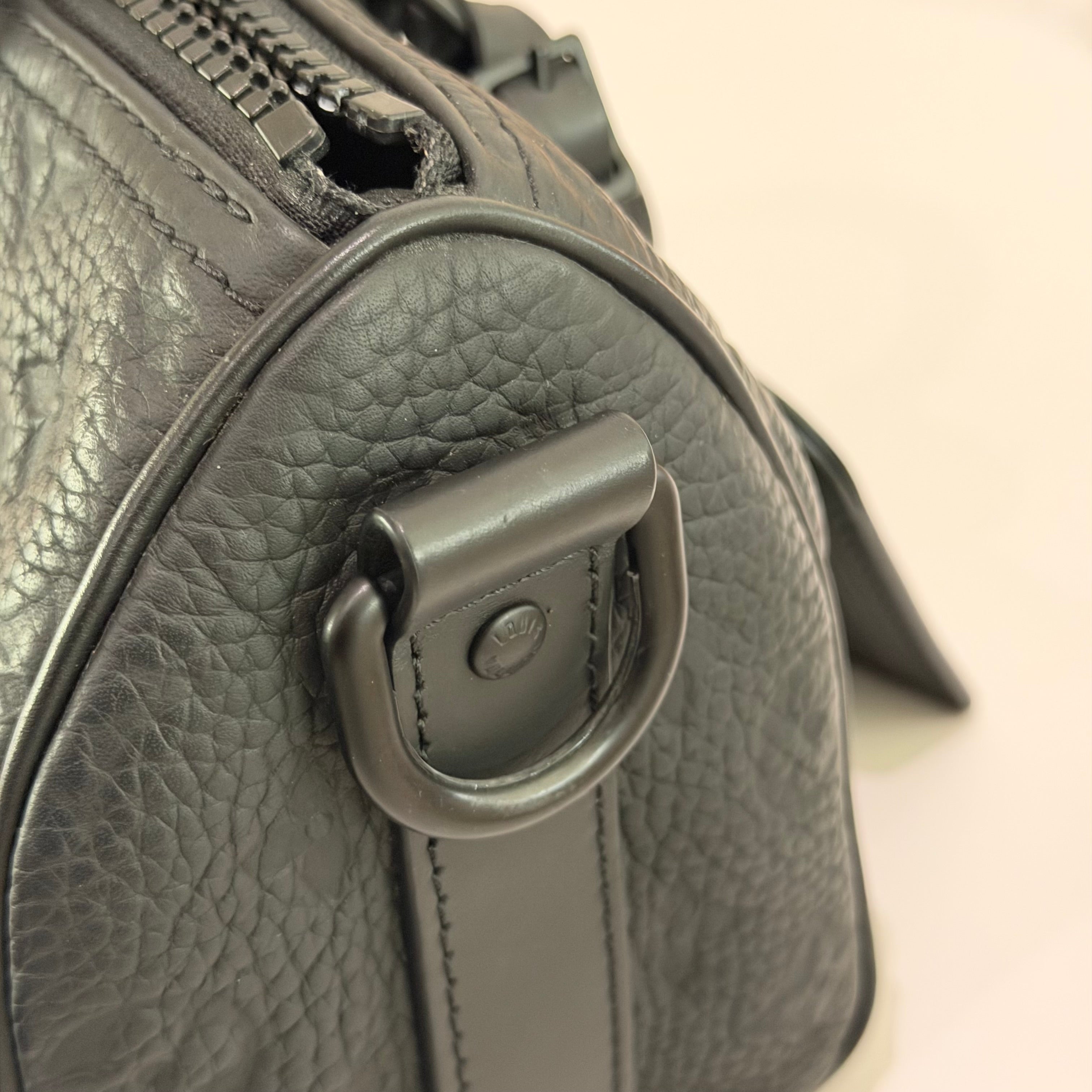 Louis Vuitton Keepall 25 Black Monogram Embossed Leather