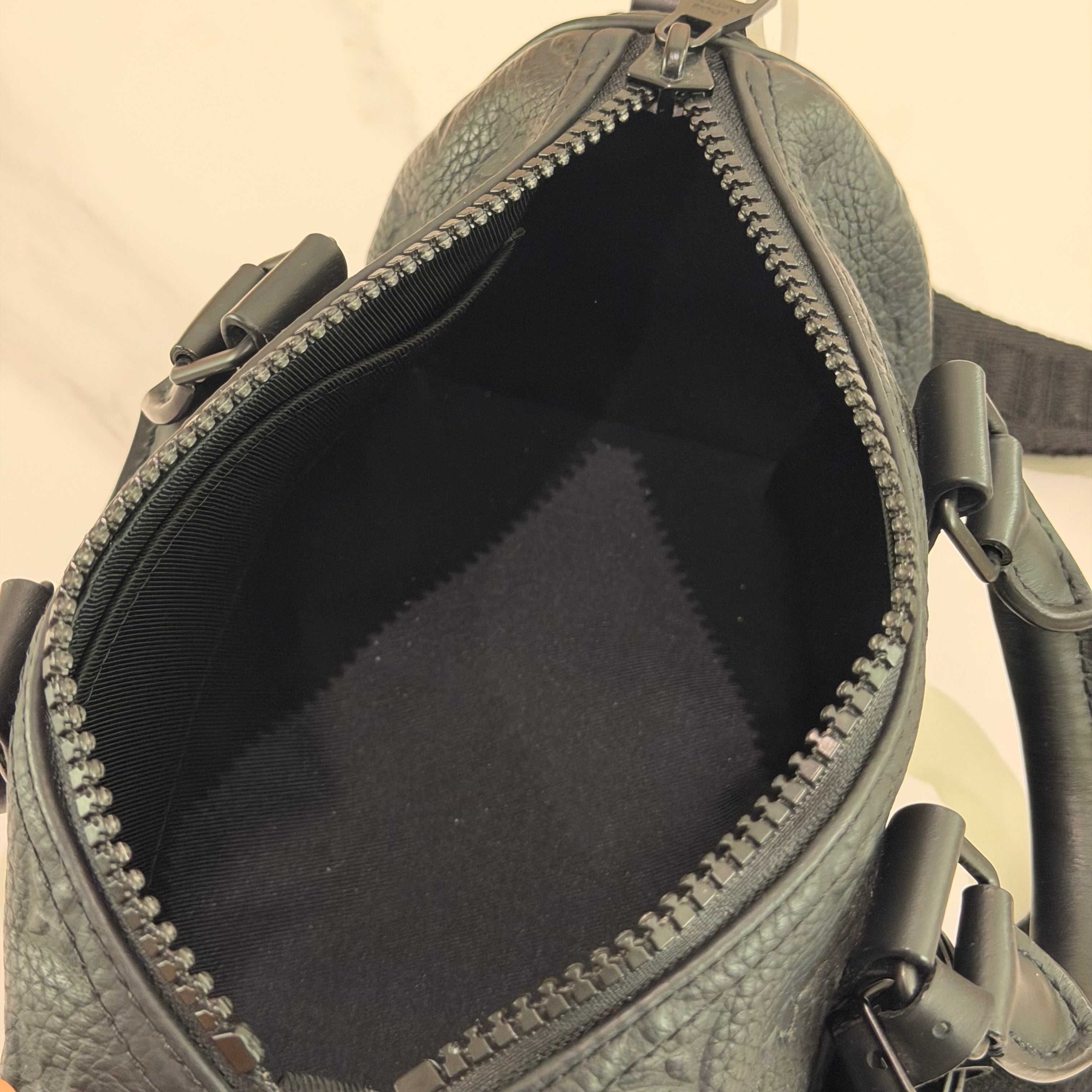 Louis Vuitton Keepall 25 Black Monogram Embossed Leather