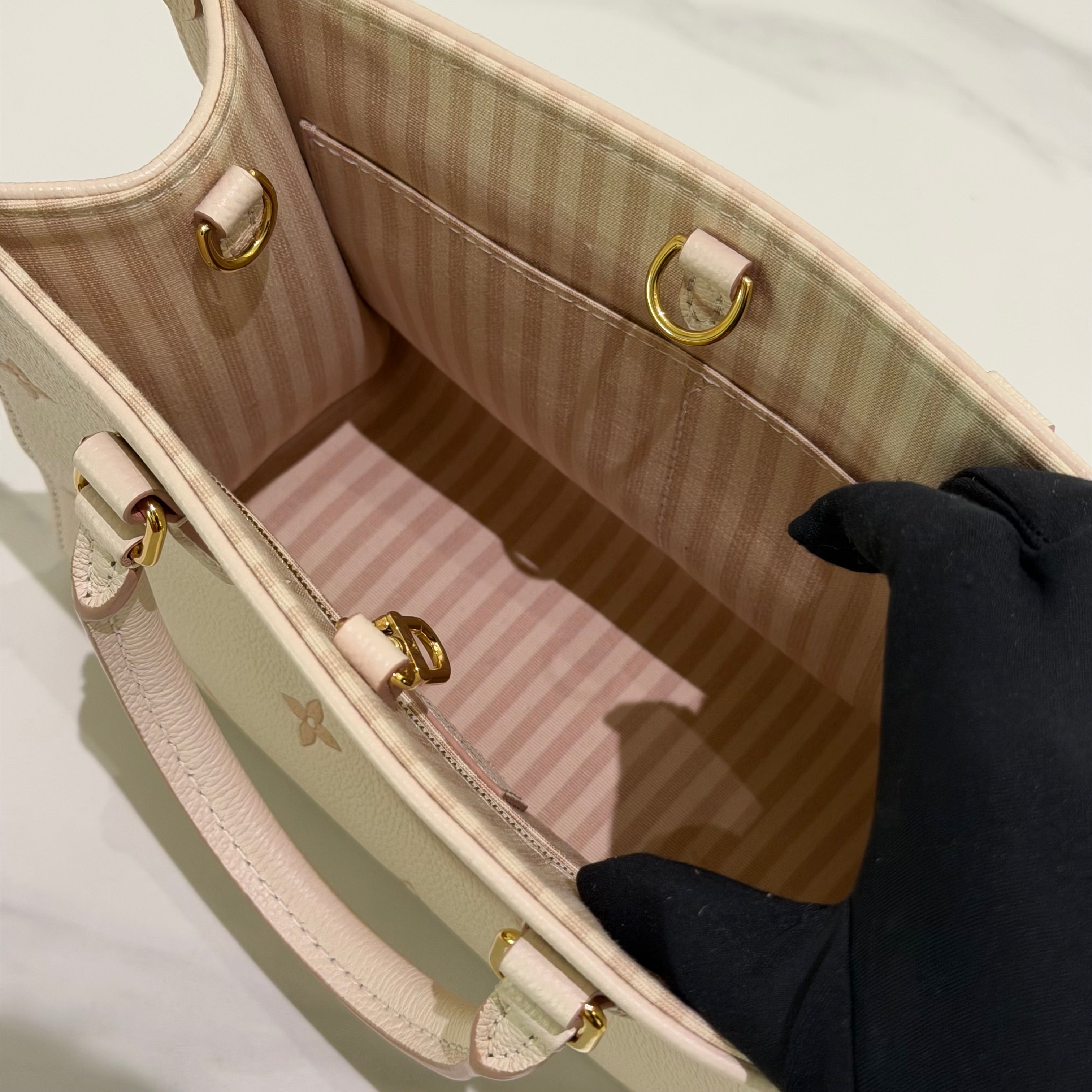 Louis Vuitton Onthego PM Almond Pink Monogram Empreinte Leather (Chip Model)