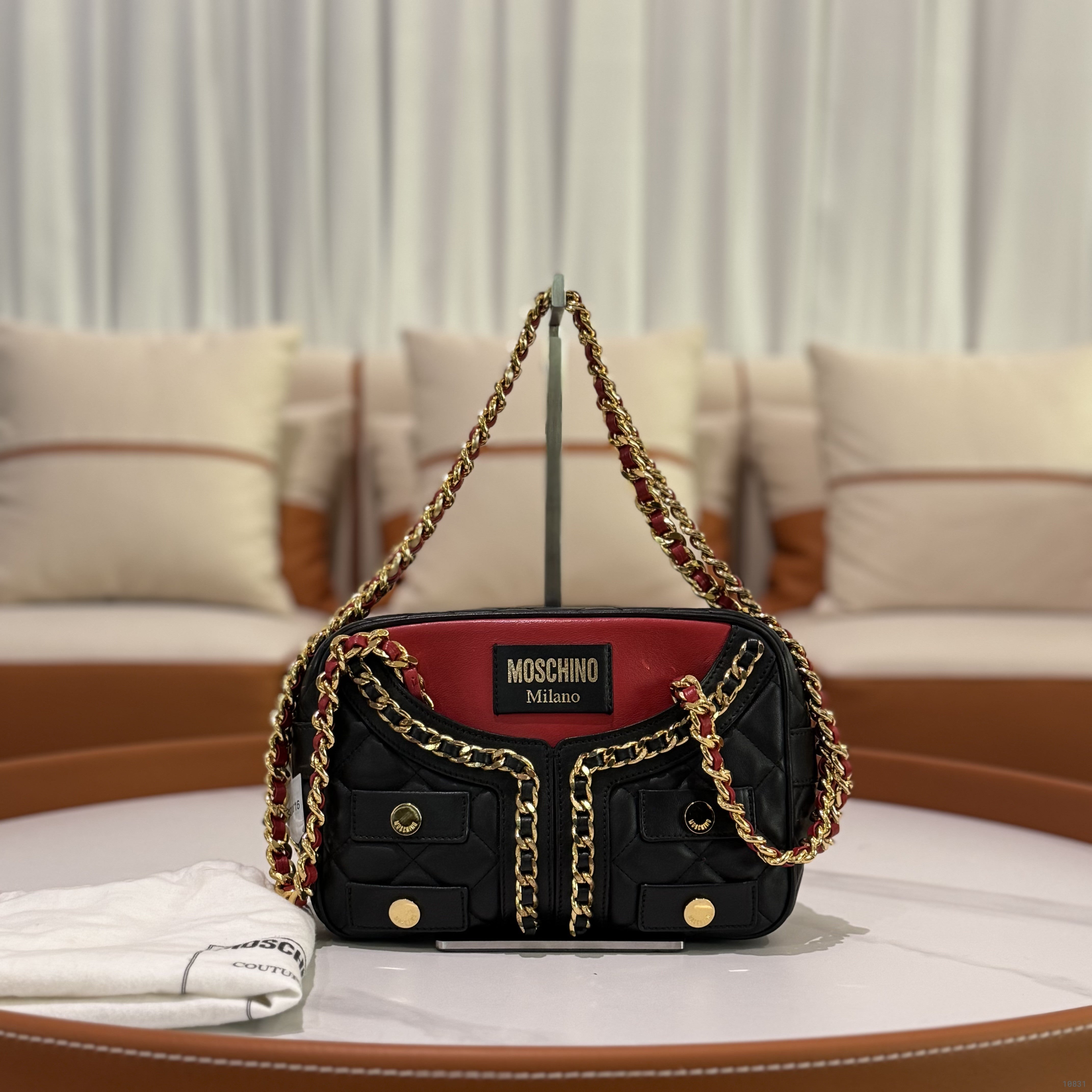 MOSCHINO QUILTED CHAIN BAG WITH CLOTHING MOTIF